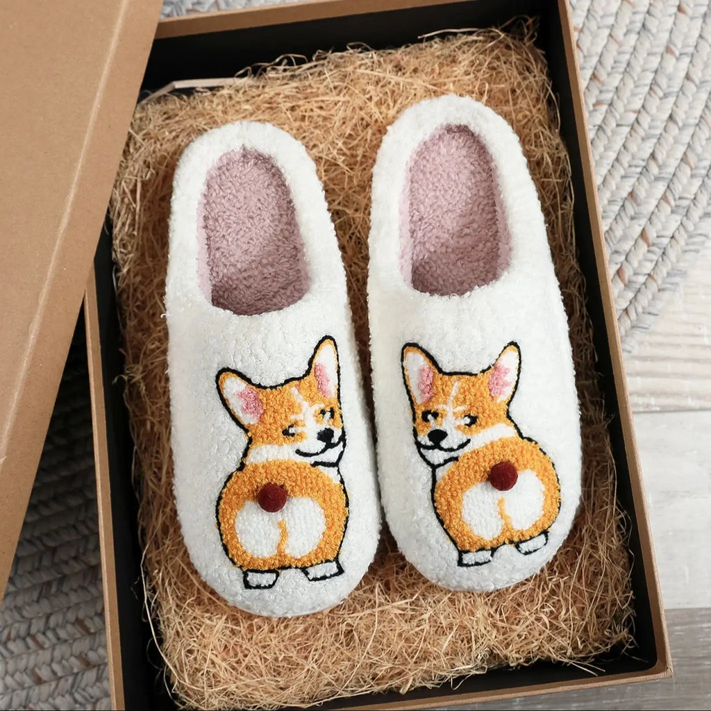 Pair of white slippers with corgi design in a box