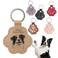 Custom leather keychain with a dog's portrait and paw-shaped keychains in various colors.