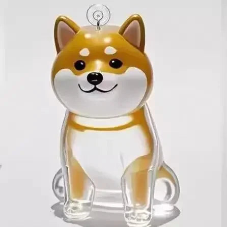 Clear acrylic ornament shaped like a dog with brown and white coloring on a light gray background