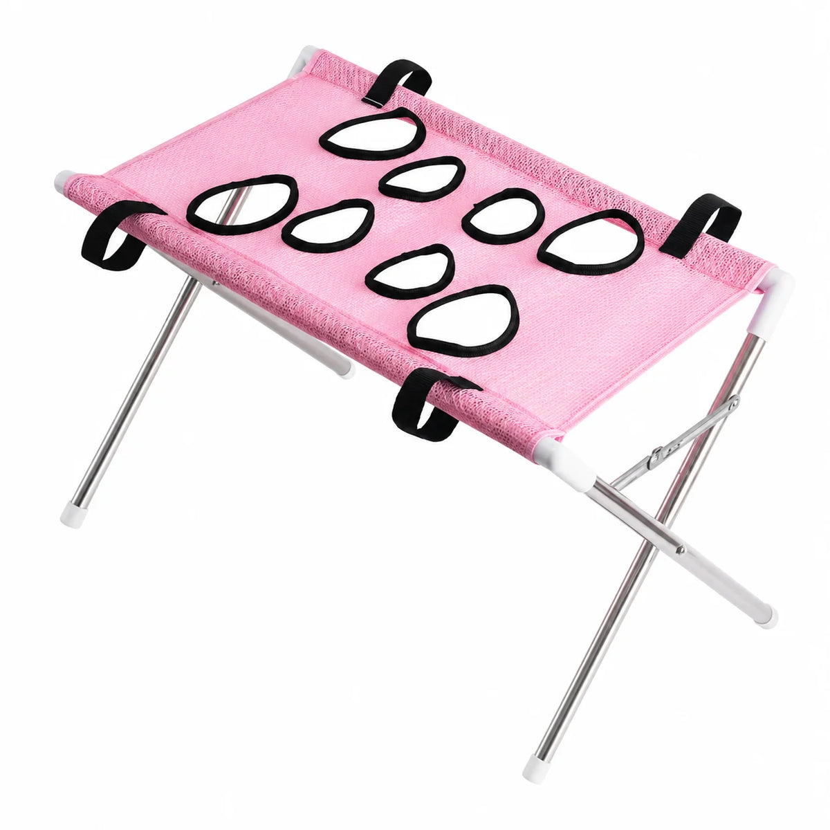 A pink pet hammock with a textured fabric sling, featuring nine black and white teardrop-shaped window cutouts and four black hanging loops, supported by a silver metal folding frame with white plastic joints.