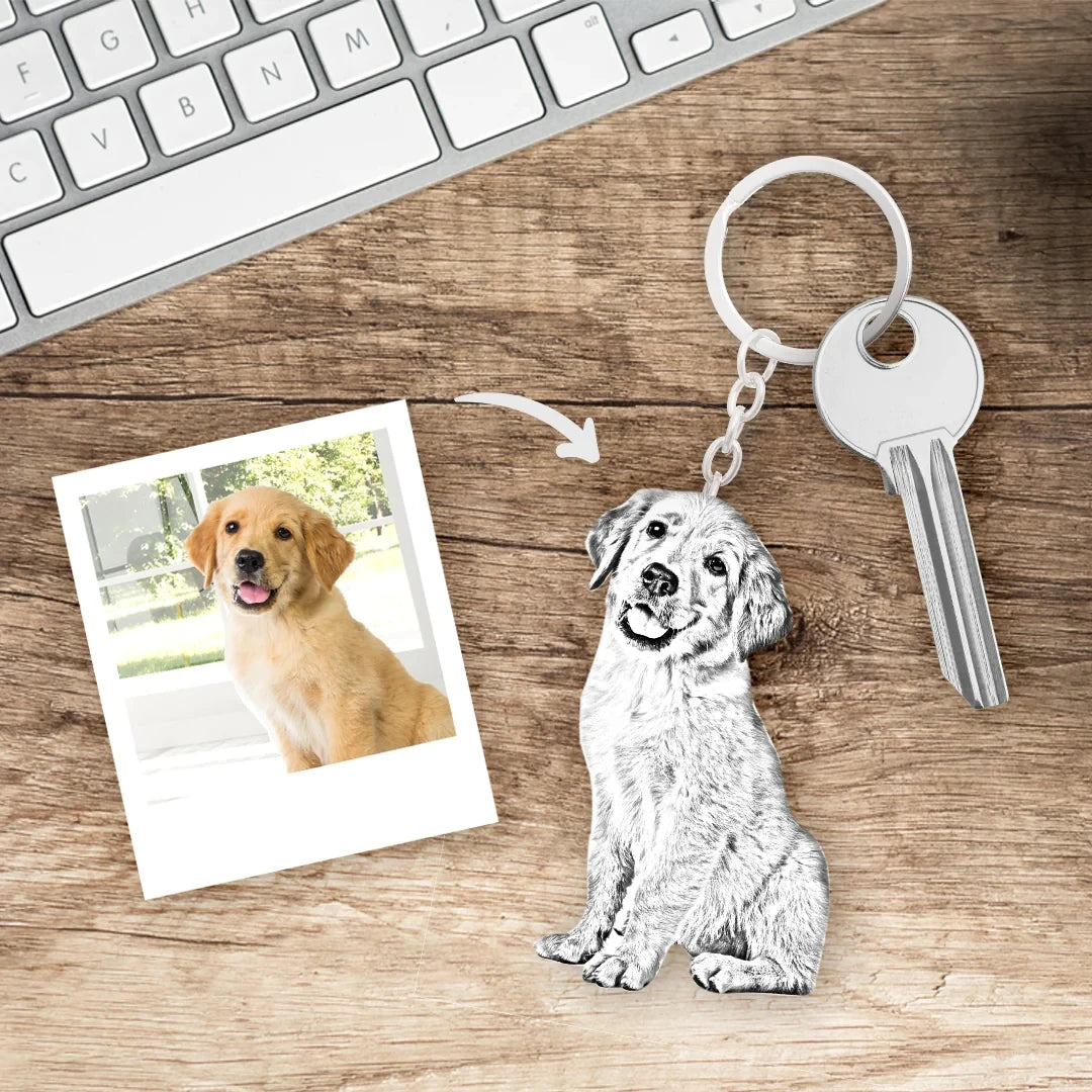 Keychain of a dog next to a photo and key on a wooden surface